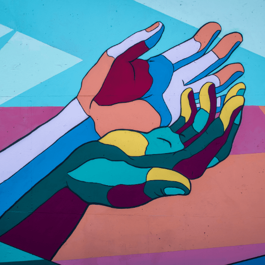 multicolored hands outstretched